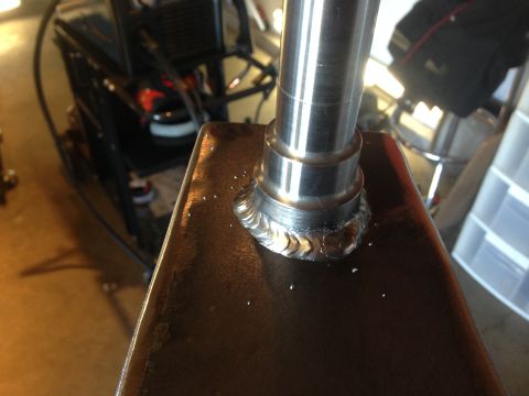 1979 Ford Bronco - Metal fabrication detail showing a welded joint on a cylindrical shaft attached to a flat plate.