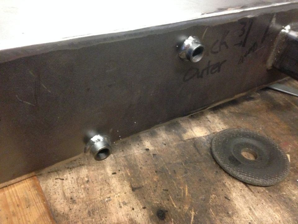 Fabricated metal part with threaded fittings and handwritten markings 'kick 3' and 'outer'