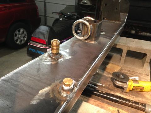 1979 Ford Bronco - Custom fabricated metal bumper with tow rings and brass fittings, likely for a truck or SUV.