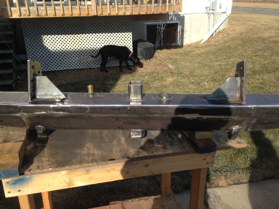 Custom metal bumper on sawhorses, with "Outer" text visible