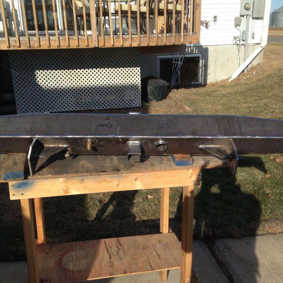 Custom steel bumper on sawhorses, with 'Order' and '80s' written on it
