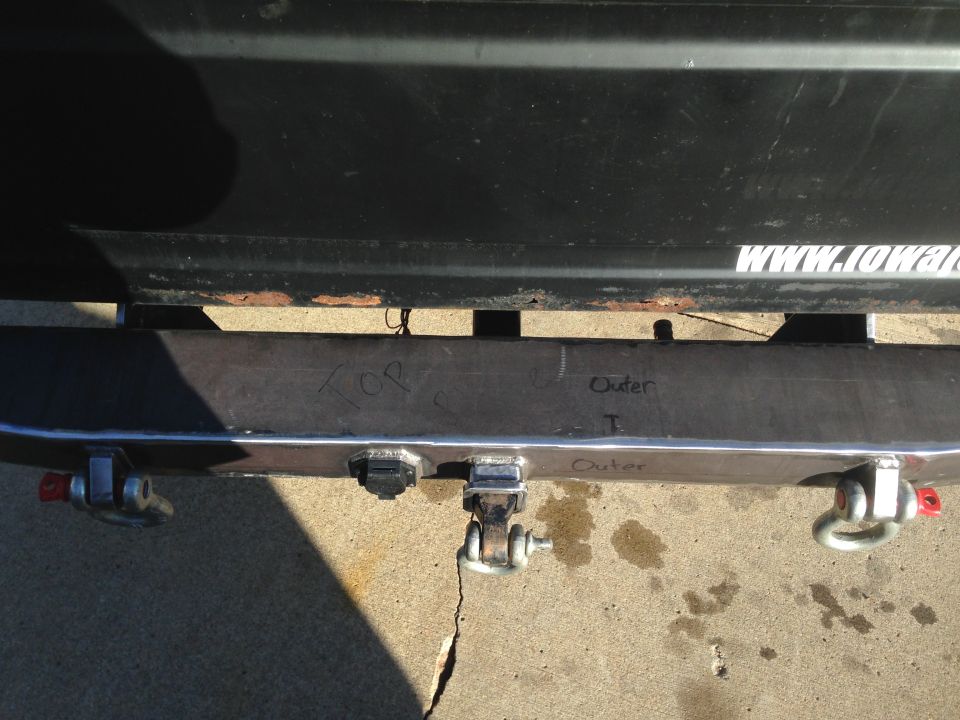 Custom fabricated rear bumper with tow hitch receiver and D-ring mounts. Handwritten markings 'TOP' and 'Outer' are visible