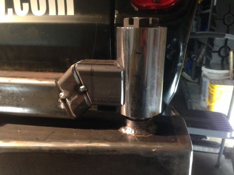 1979 Ford Bronco - A close-up view of a custom-fabricated metal bracket welded to a vehicle's frame, likely a trailer hitch receiver extension. The bracket is…