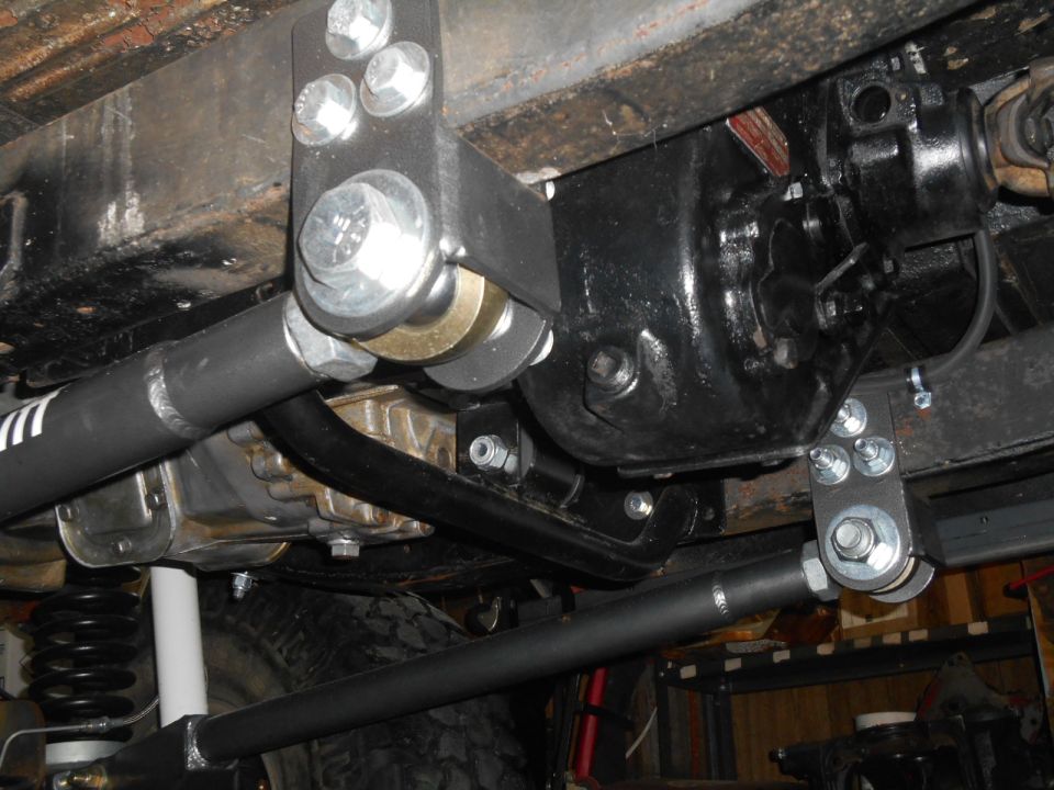 Underside view of vehicle suspension and differential housing.