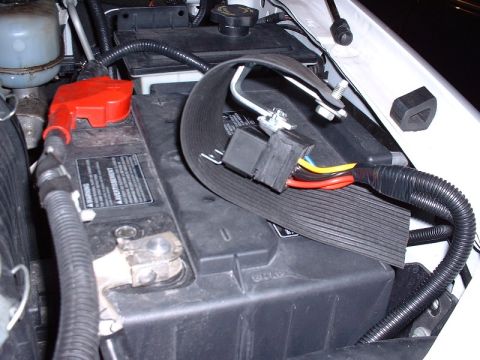 2003 Ford Excursion - Relays with homemade battery mounting bracket and rain guard.