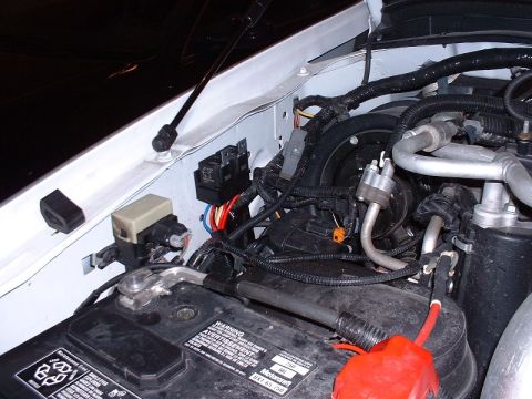 2003 Ford Excursion - passenger side relays mounted on fender wall.