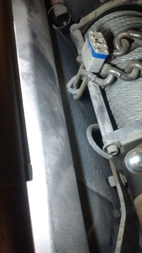 1985 Ford Bronco - A winch drum is visible with a chain and padlock securing it.