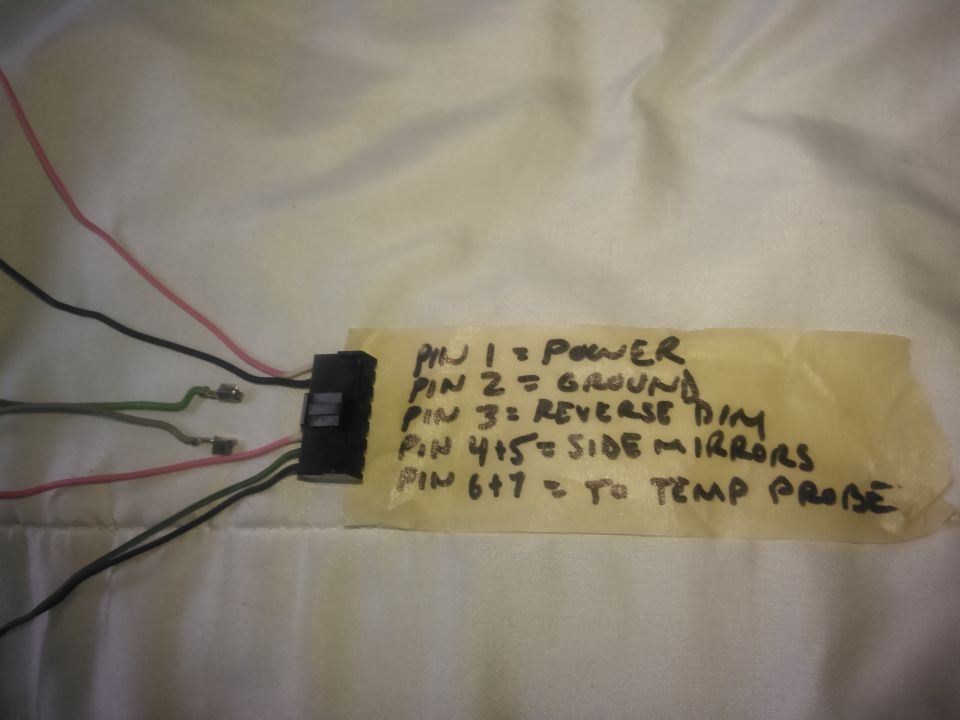 the wiring is pretty simple. it needs a power and ground. for the tempature display it needs 2 wires ran for the sensor. optionally you can add the reverse wire but it is not needed. there are 2 wires for the side mirrors which can be removed. instead of jsut cutting them i removed the pins completely