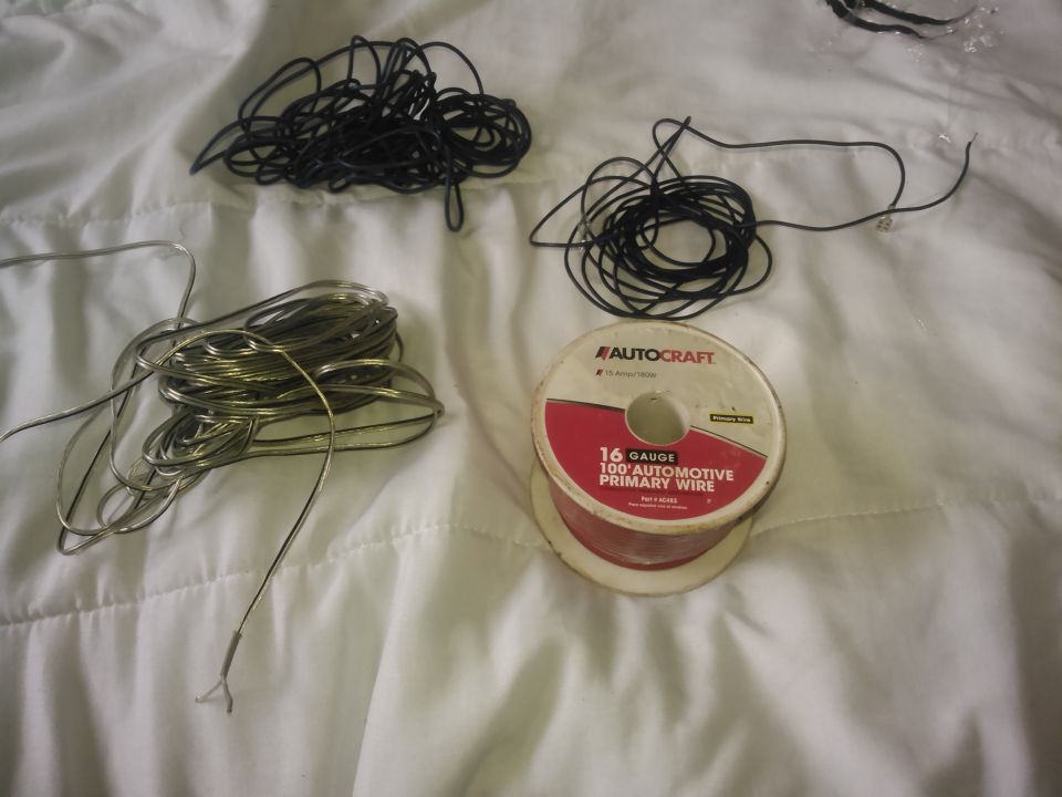 this is jsut soem of the wiring i had laying around. i had a spool of red wire i used for the power. i had a black wire which is smaller than I like but it worked for the ground. i had some blue wire for the reverse signal. i had some cheap speaker wire for running the sensor to the front of the truck