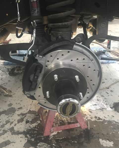 1995 Ford Bronco - This image shows a vehicle's brake system, including a new rotor and caliper, with a locking hub.