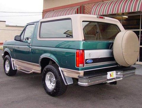1996 Ford Bronco - This 1996 Ford Bronco is shown from the rear quarter angle, its two-tone paint and spare tire carrier.