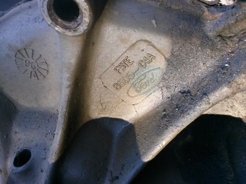 1996 Ford Bronco - Close-up of a Ford engine part showing a '96' stamp and the part number F5TE 8505-C4A, consistent with a 1996 model year.