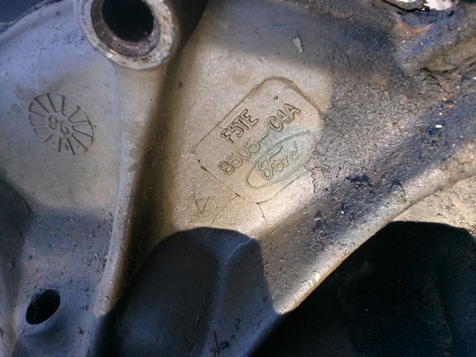 Engine part with '96' stamp and Ford logo, part number F5TE 8505-C4A