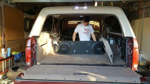 1996 Ford Bronco - Installing a dual subwoofer box in the rear cargo area of a 1996 Ford Bronco.