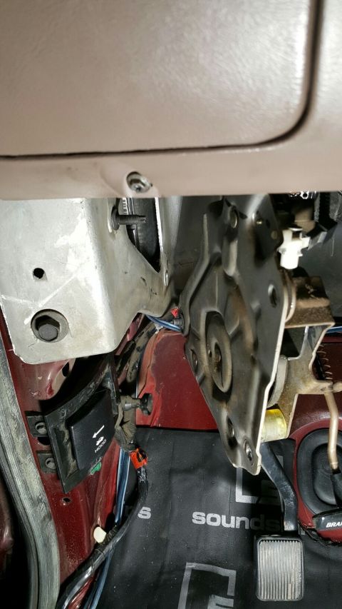 1996 Ford Bronco - Close-up view of the interior under the dashboard, showing pedals and wiring harnesses.