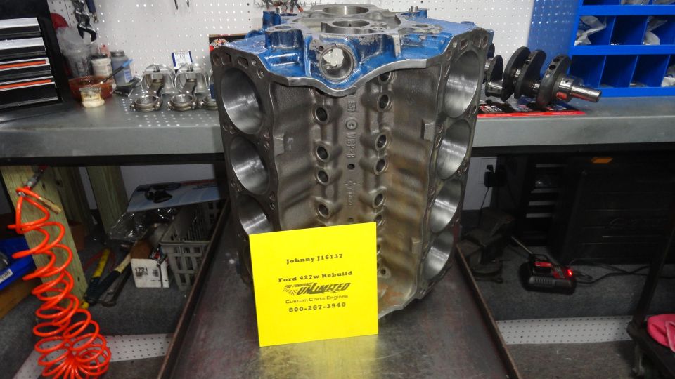Ford 427W engine block with a yellow tag on it