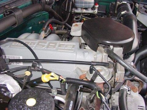 1996 Ford Bronco - Engine bay detail of a Ford 5.8L V8, likely from a 1996 model year vehicle.