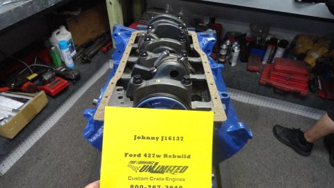 1982 Ford Bronco - Engine block assembly with a yellow sign indicating a Ford 427w rebuild.