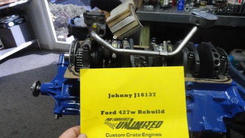 1982 Ford Bronco - A Ford 427w engine is shown during a rebuild process, with a yellow card detailing the work.