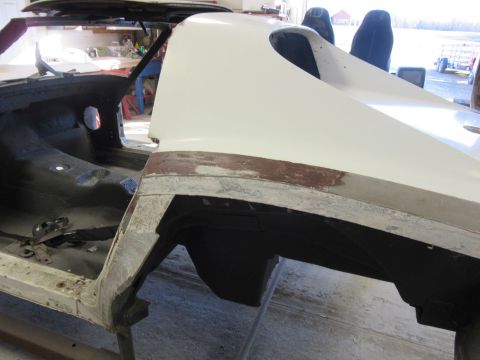 1976 Chevrolet Corvette - Bodywork in progress on a 1976 Chevrolet Corvette, showing the rear quarter panel and interior structure.