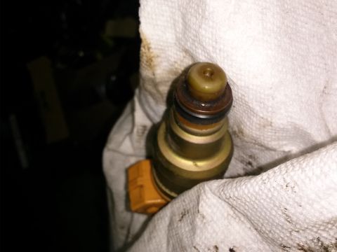 1996 Ford Bronco - A single fuel injector is shown, likely removed for service or inspection.
