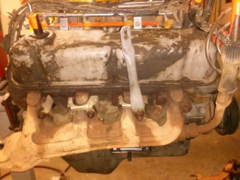 1996 Ford Bronco - Close-up view of a Ford engine, likely undergoing maintenance or repair.