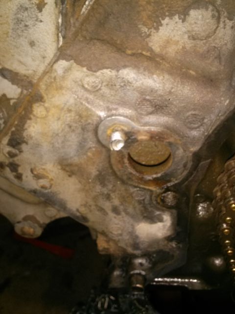 1996 Ford Bronco - Close-up view of a corroded engine block casting, likely showing wear and tear.