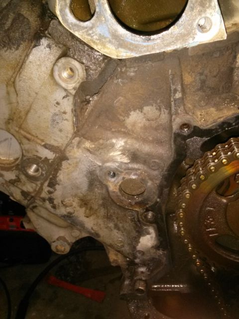 1996 Ford Bronco - Close-up view of an engine block's internal components, including a timing chain and gears.