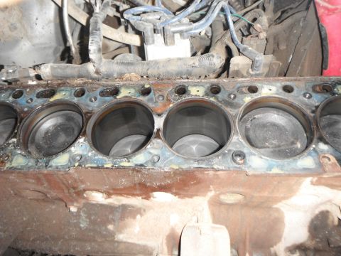 1995 Ford F-150 - Close-up of an engine block's cylinders, indicating internal engine work or repair.