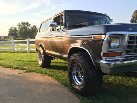 1978 Ford Bronco - This 1978 Ford Bronco is shown in a three-quarter front view, highlighting its two-tone brown and silver paint scheme.