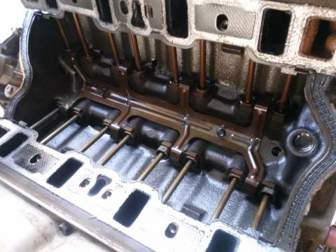 1996 Ford Bronco - Close-up view of an engine block's internal components, showing pushrods and intake ports.