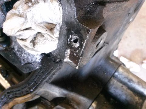 1996 Ford Bronco - Engine block detail with a rag covering a hole, likely during maintenance.