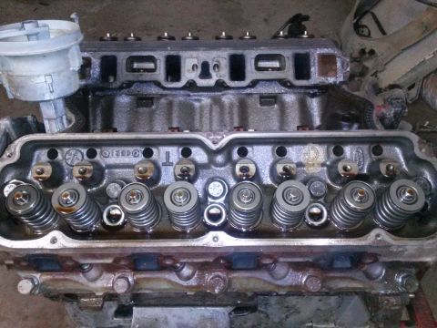 1996 Ford Bronco - This is a close-up view of an engine's cylinder head, showing the internal valve train components.