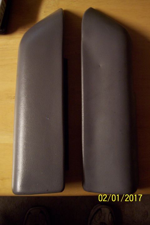 1995 Ford Bronco - Two gray interior door handles are shown, likely for a vehicle's interior.