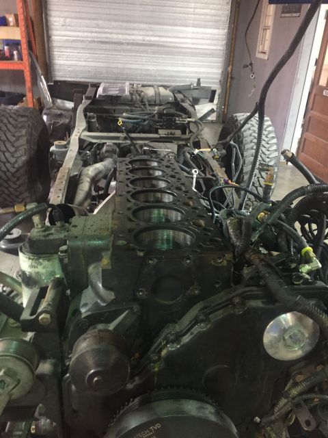 1995 Ford Bronco - The engine is disassembled, revealing the cylinder bores and surrounding chassis components.