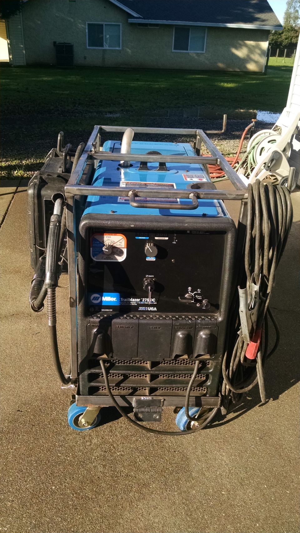 Blue Miller Trailblazer 275DC welder with cables and metal frame