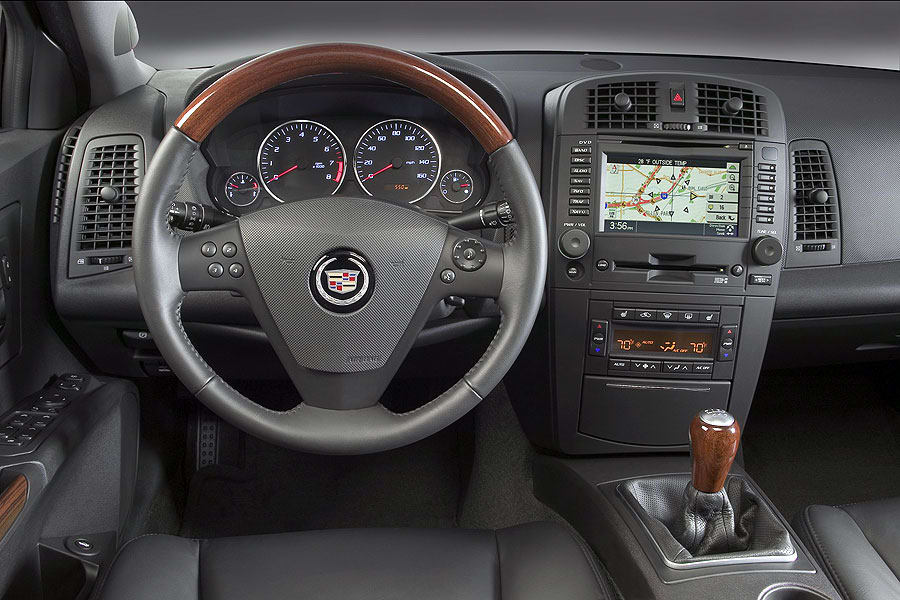 Interior dashboard of a 2007 Cadillac CTS, showing steering wheel, navigation, and gear shifter.