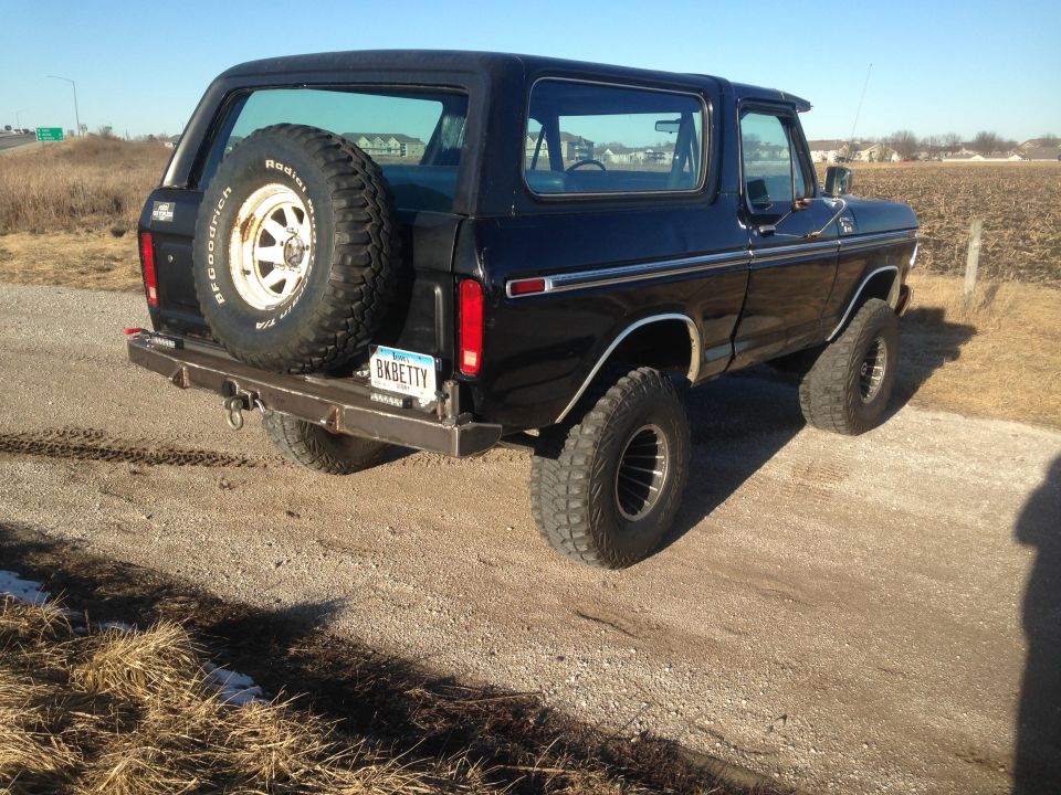 Black Ford Bronco with spare tire on rear bumper and license plate BKBETTY