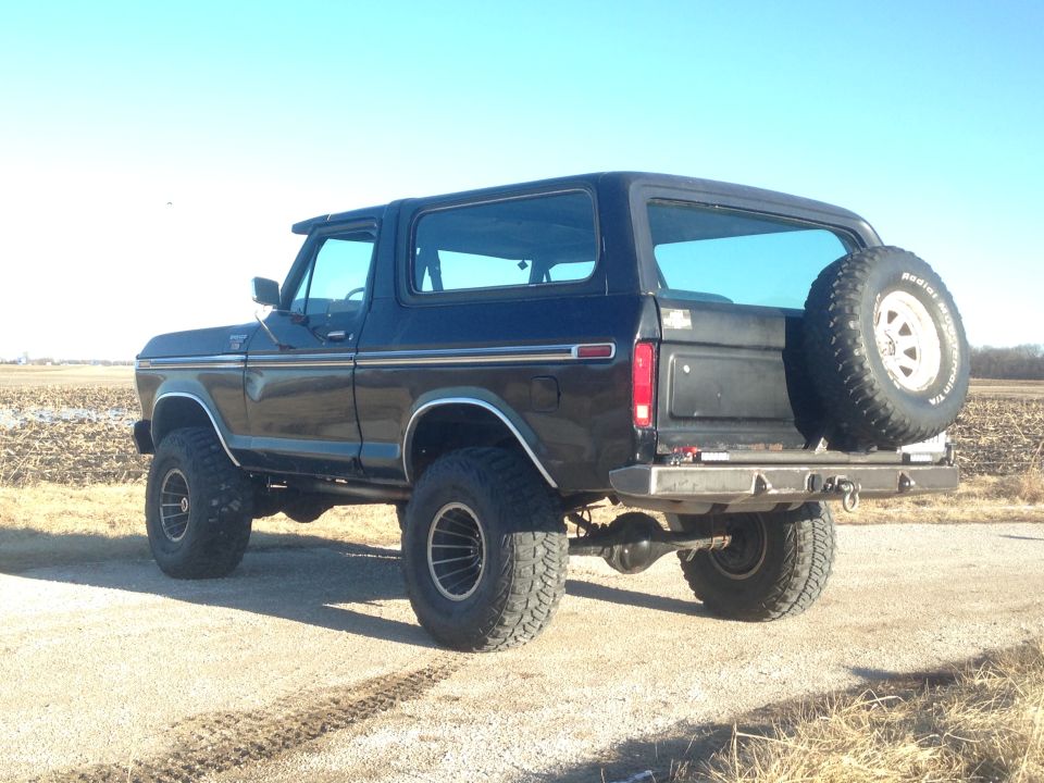 1979 Ford Bronco, Black Betty, rear passenger side view, lifted, spare tire on back