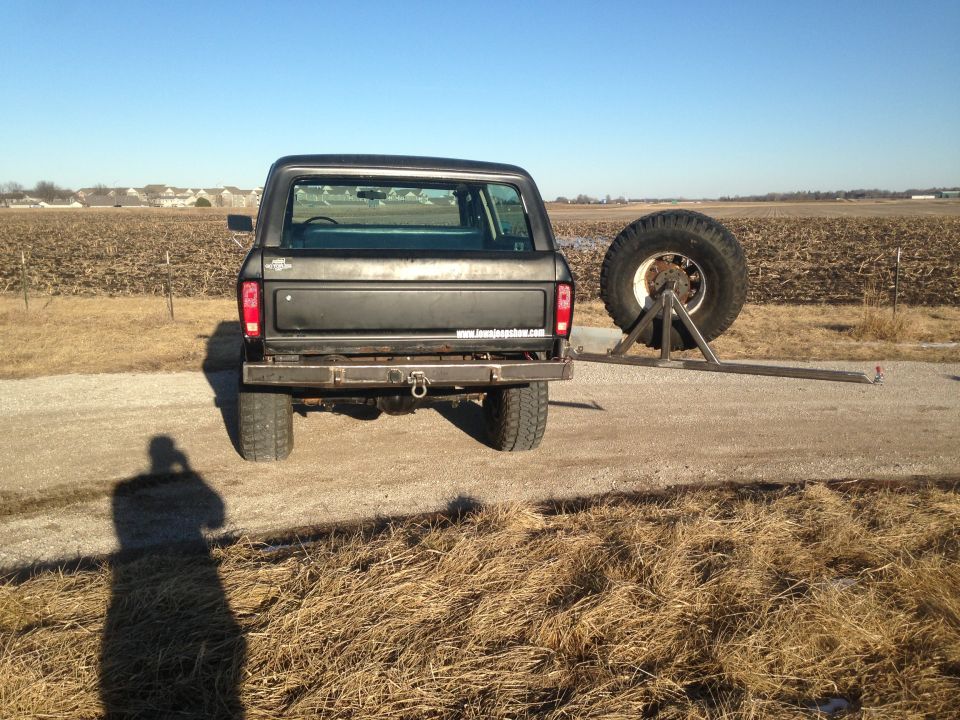 Black 1979 Ford Bronco rear view with custom spare tire carrier