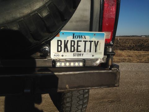 1979 Ford Bronco - A close-up rear view of a vehicle bumper showing an Iowa license plate that reads "BKBETTY STORY". A row of five LED lights is mounted belo…