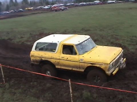 1994 Ford Explorer - This vintage SUV navigates a muddy track during an off-road event.