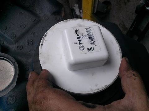 1996 Ford Bronco - A person's hands are holding a white PVC plug with a label that reads "NDS 4" PVC PLUG MALE IPS 41P8" over a circular white object, possibl…