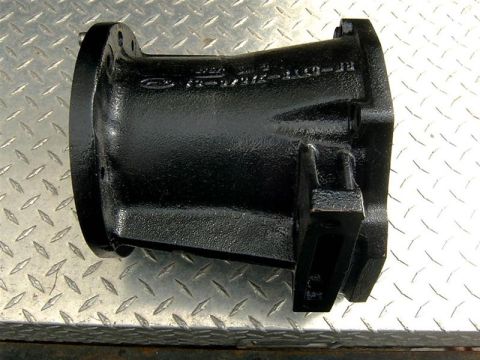1982 Ford Bronco - Close-up of an unidentified black plastic automotive part.