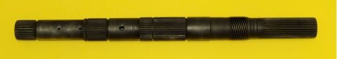 1982 Ford Bronco - A splined metal shaft with several holes is shown against a yellow background.