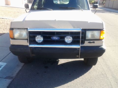 1991 Ford Bronco - This 1991 Ford Bronco features a chrome grille guard with integrated fog lights.