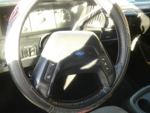 1991 Ford Bronco - Interior view of a 1991 Ford Bronco, highlighting the steering wheel and dashboard instrumentation.