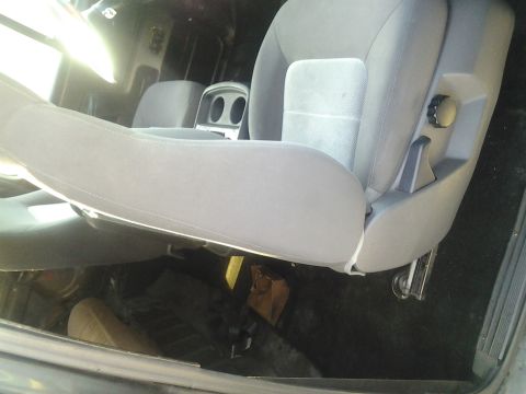 1991 Ford Bronco - Interior view of a vehicle's gray fabric seats and console.