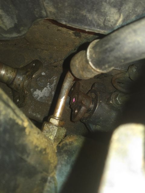 1980 Ford Bronco - A detailed view of an engine part, showing hoses and metal fittings, with a watermark indicating the source.