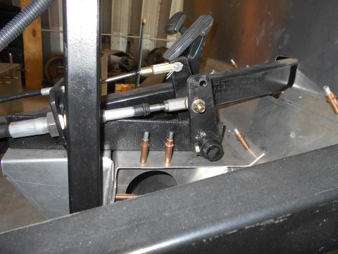 1992 Ford Bronco - Close-up view of the brake pedal mechanism and associated linkages within a vehicle.